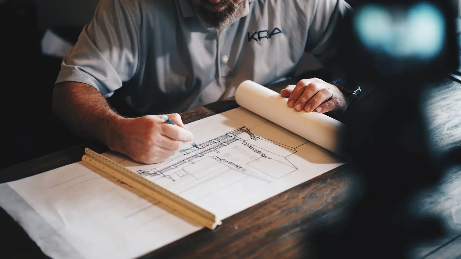 Property professional reviewing plans in an organised office environment